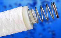 Reusable knife-edge seal end cap with stainless steel spring